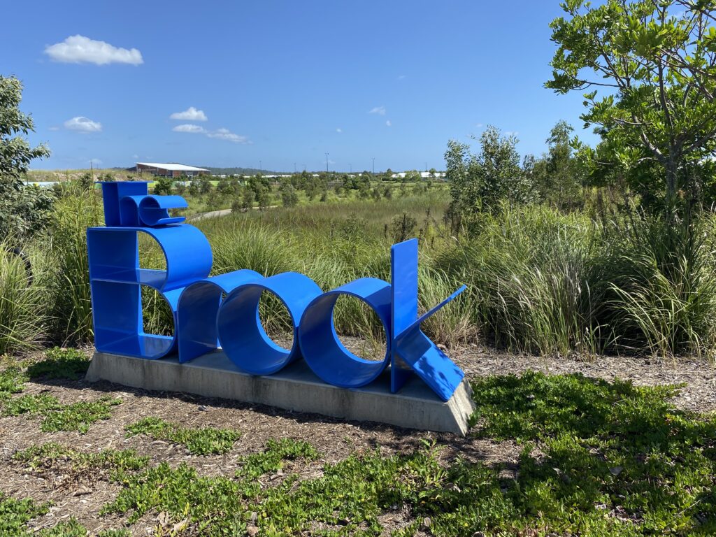 The Brook — a man-made wetlands and nature corridor winding through the Aura estate in southeast Queensland, featured in Vol I of the Atlas Brief